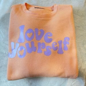Love yourself orange crewneck luciraineco Medium